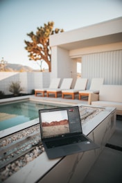 black laptop computer on white table