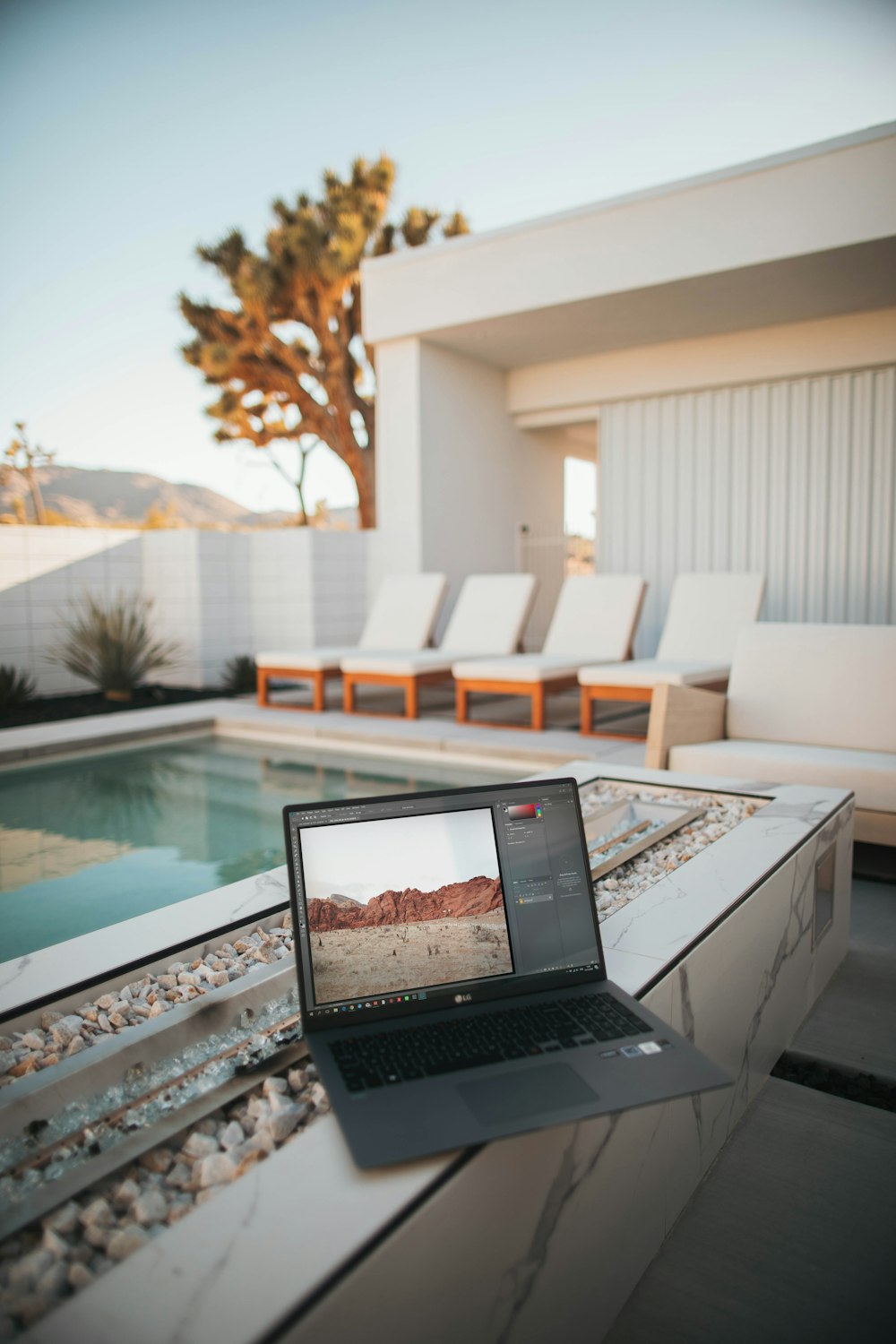 black laptop computer on white table