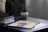 A close-up of a digital tablet displaying artwork.