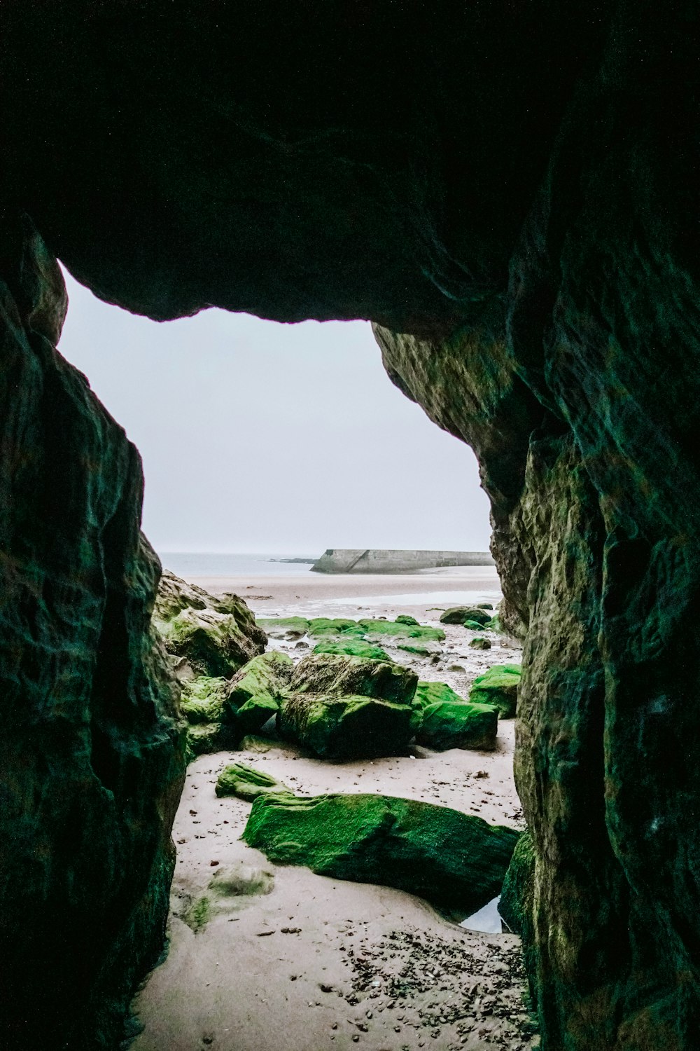 brown rock formation near sea during daytime