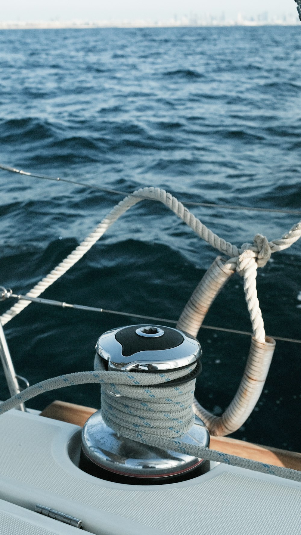 white and black life buoy on blue sea during daytime