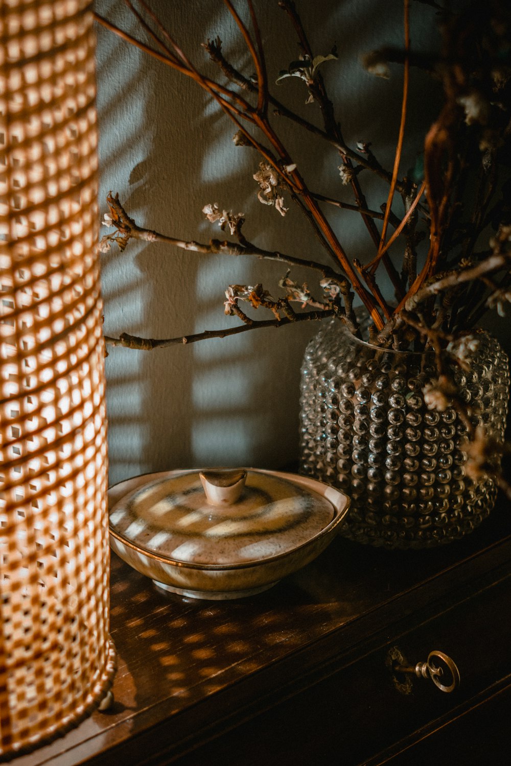 clear glass candle holder on brown wooden table