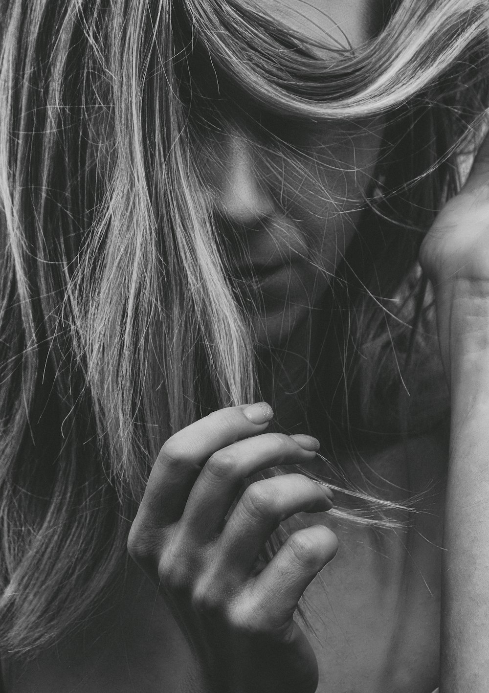 grayscale photo of womans hand