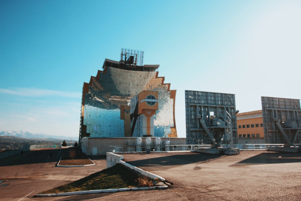 brown and white concrete building under blue sky during daytime