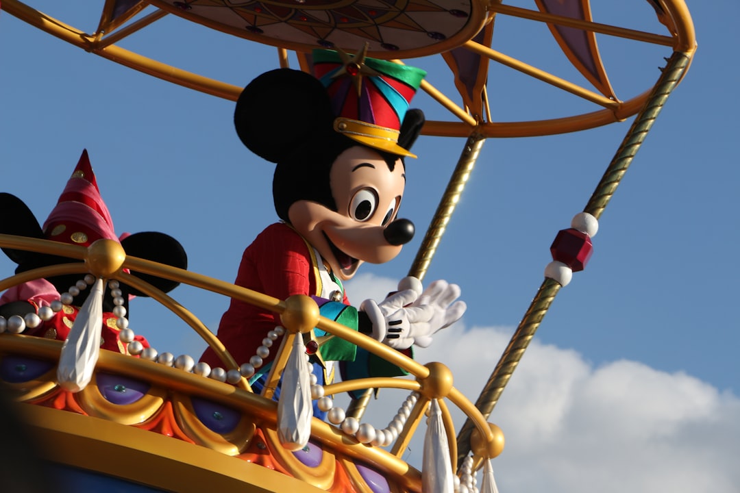 mickey mouse riding on ferris wheel under blue sky during daytime - Some old photos of a parade @ Walt Disney World's Magic Kingdom.