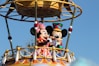 mickey mouse riding on swing ride