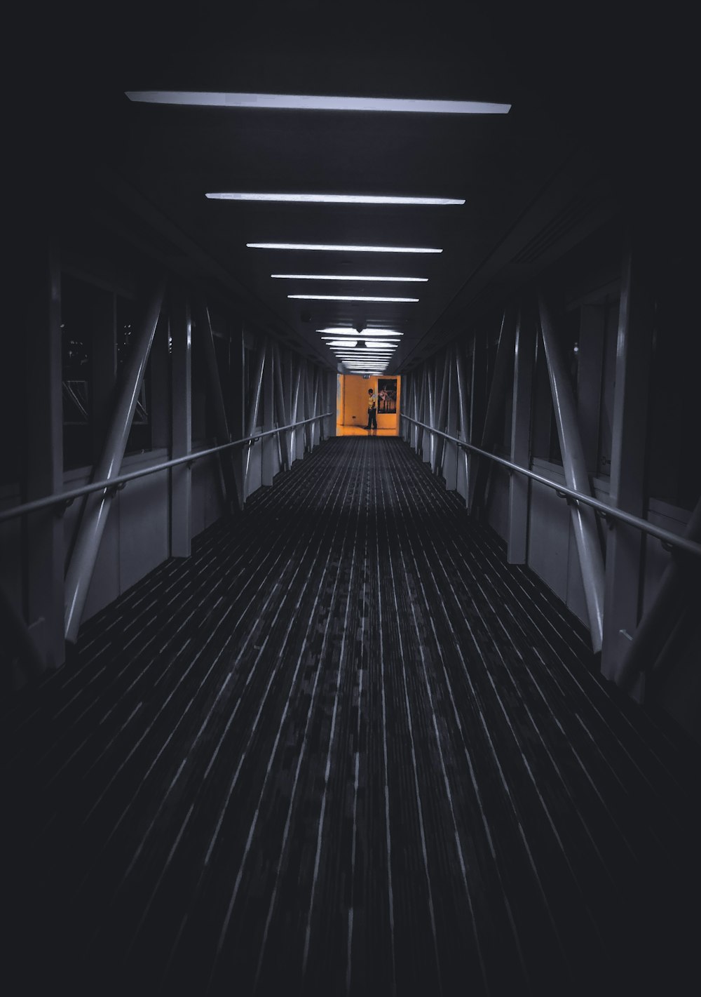 black wooden tunnel with white ceiling light