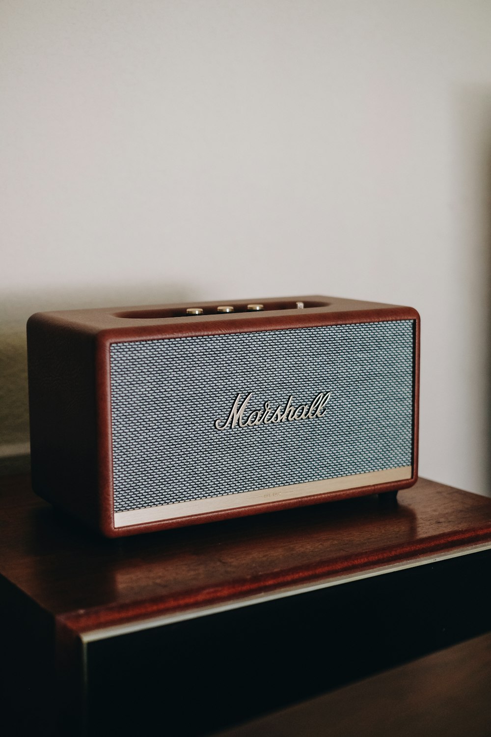 a radio sitting on top of a wooden table