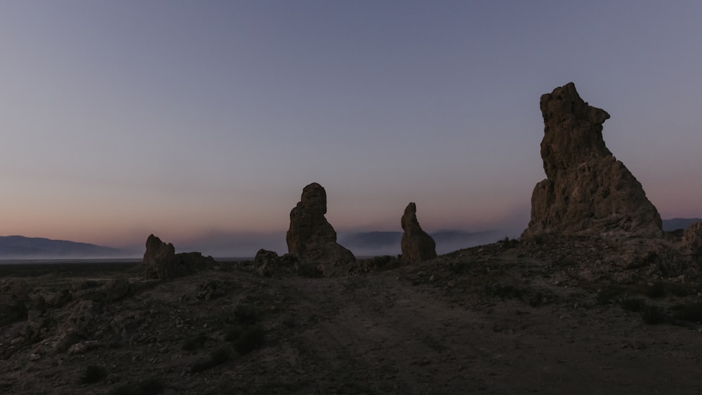 brown rock formation during sunset