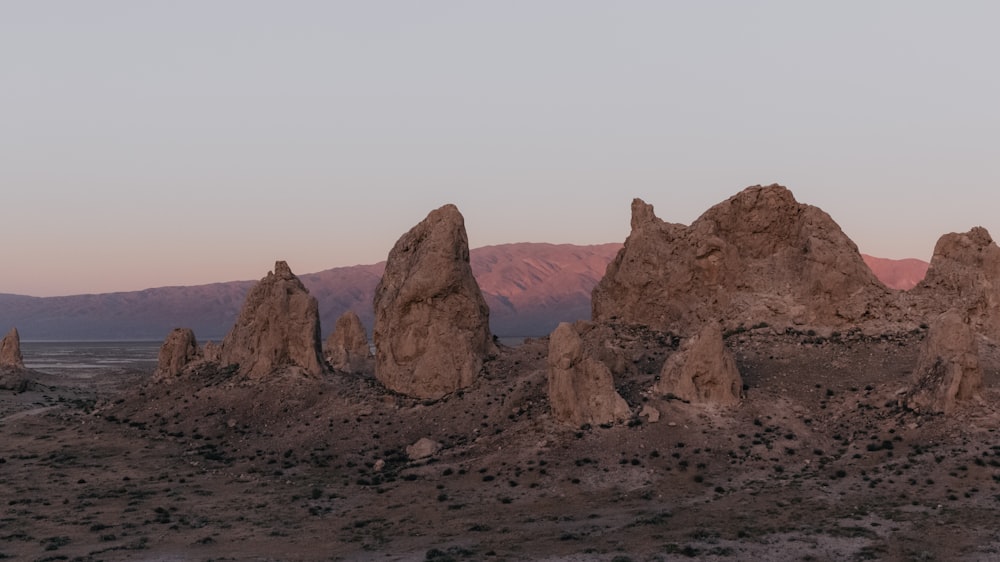 brown rock formation under white sky during daytime