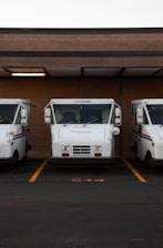 white van on gray asphalt road during daytime