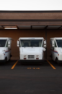 white van on gray asphalt road during daytime