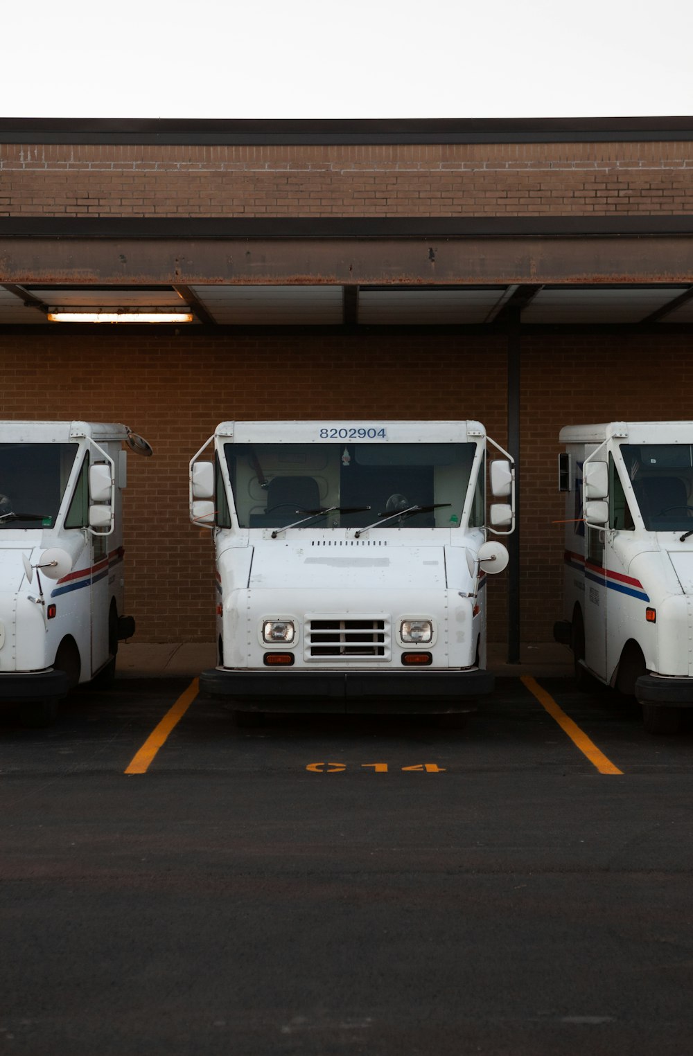 white van on gray asphalt road during daytime