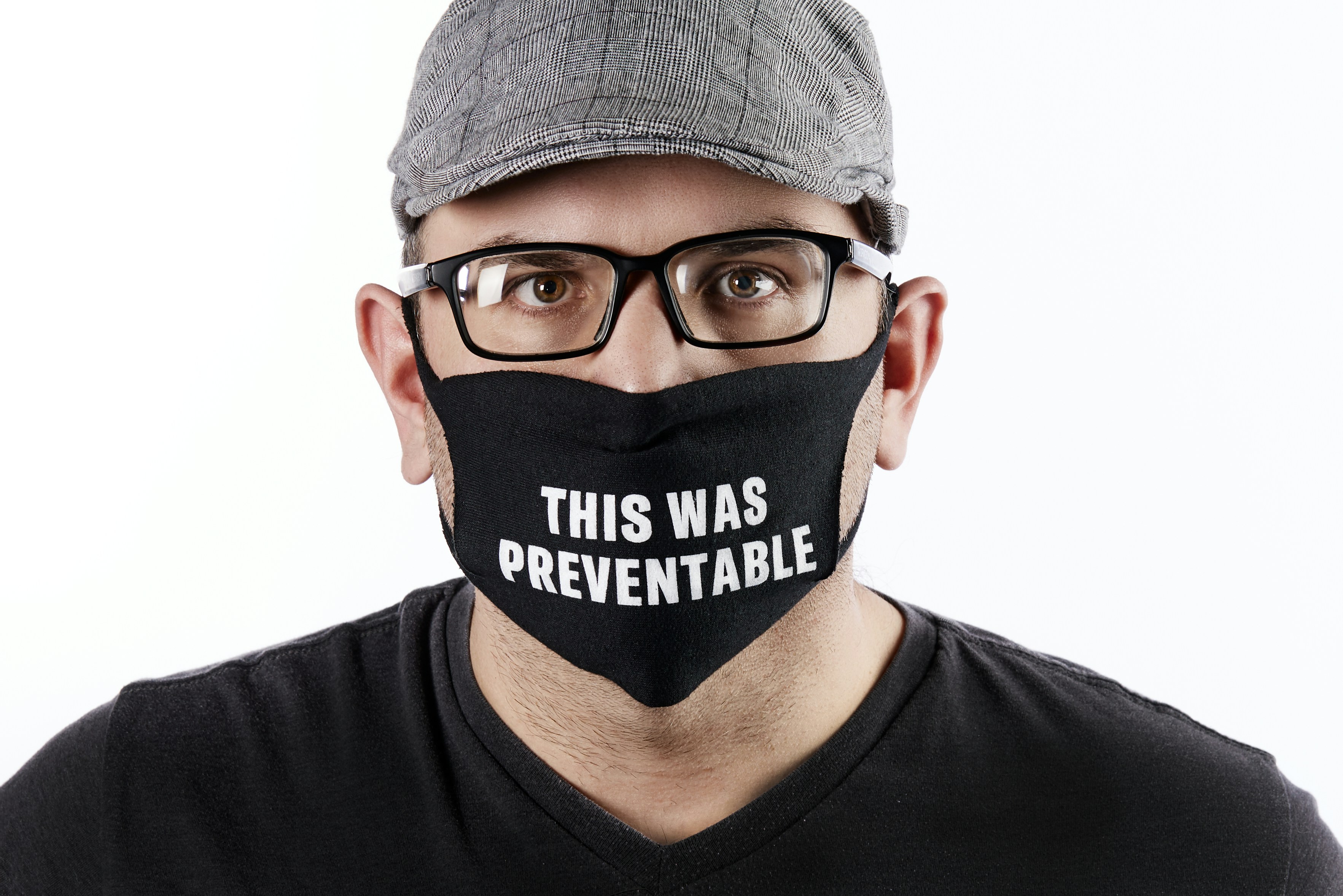 man in black and white crew neck shirt wearing black framed eyeglasses