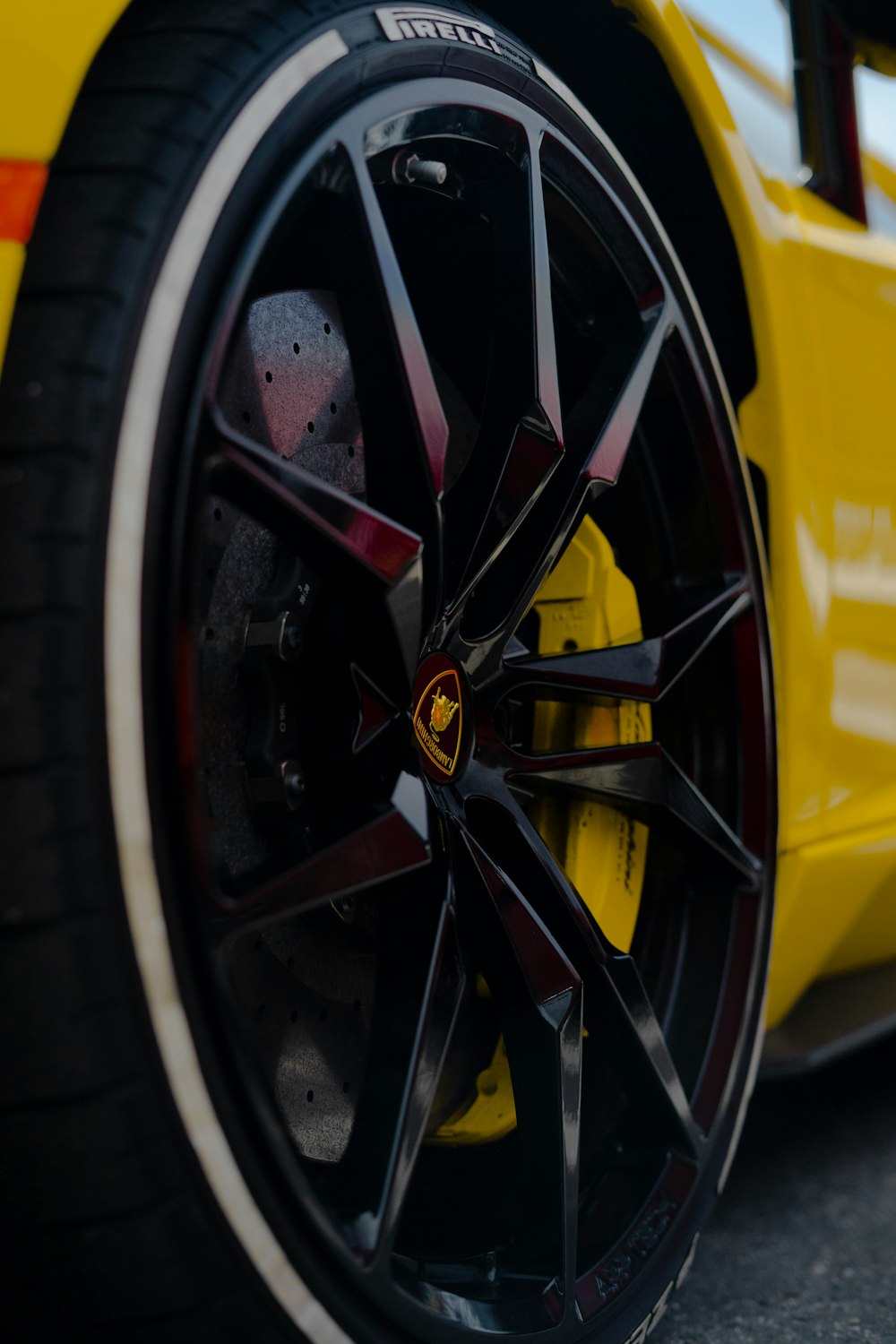 black and yellow wheel with tire