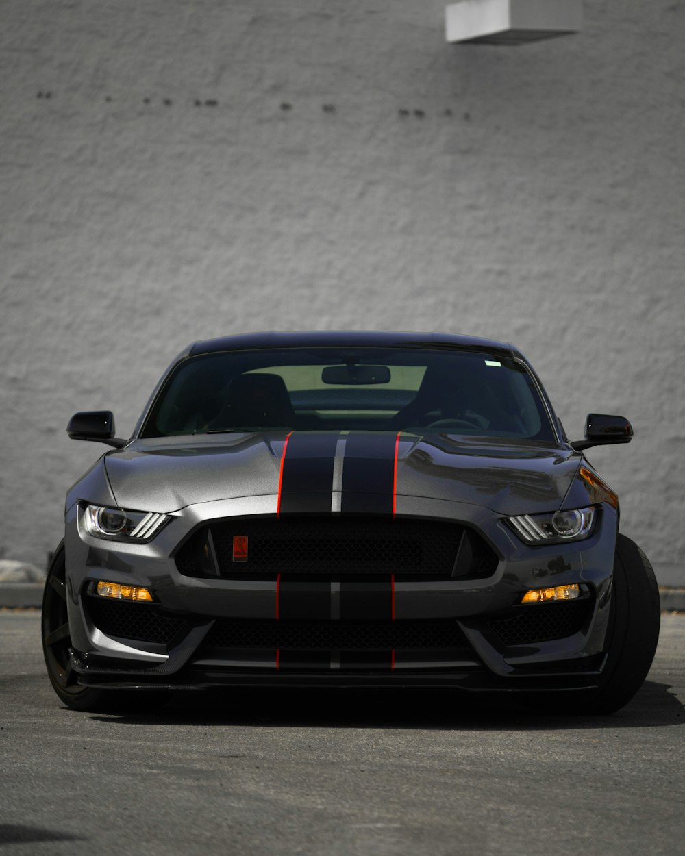 Black Ford Mustang On Gray Pavement Photo Free Grey Image On Unsplash