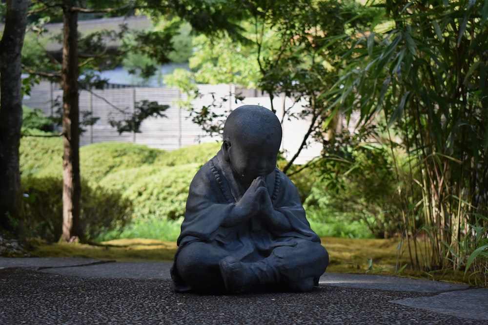 man in black robe statue