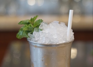 ice in clear plastic cup with straw