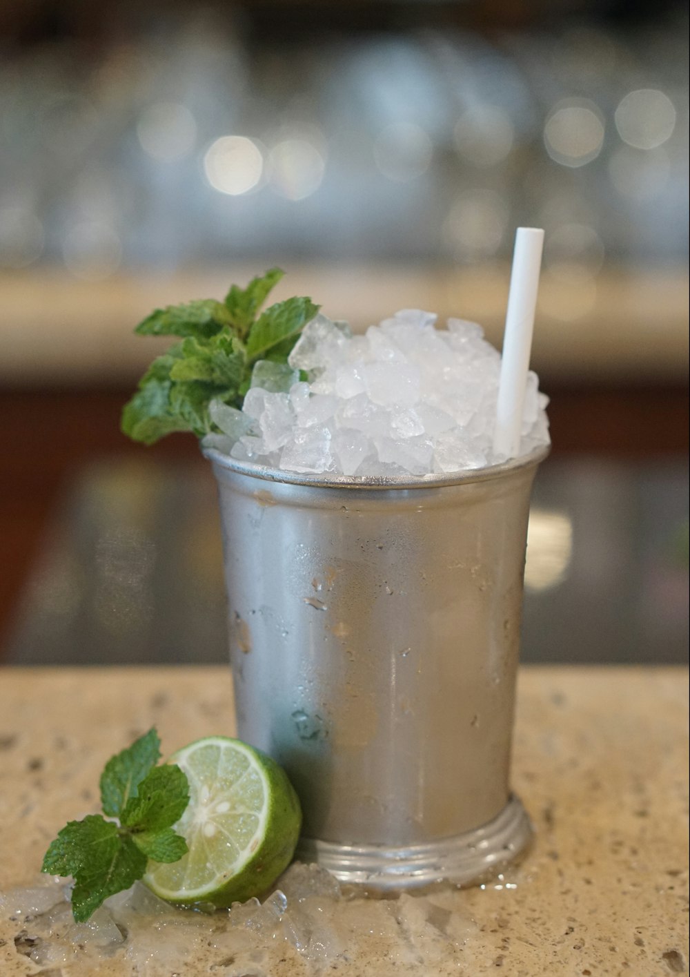 ice in clear plastic cup with straw