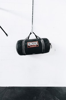 a boxing bag hanging from a rope in a gym