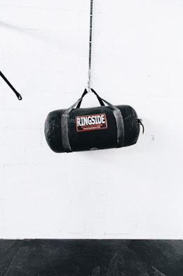 a boxing bag hanging from a rope in a gym