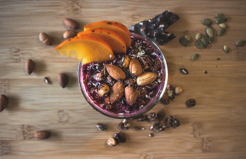 sliced fruit on blue ceramic bowl