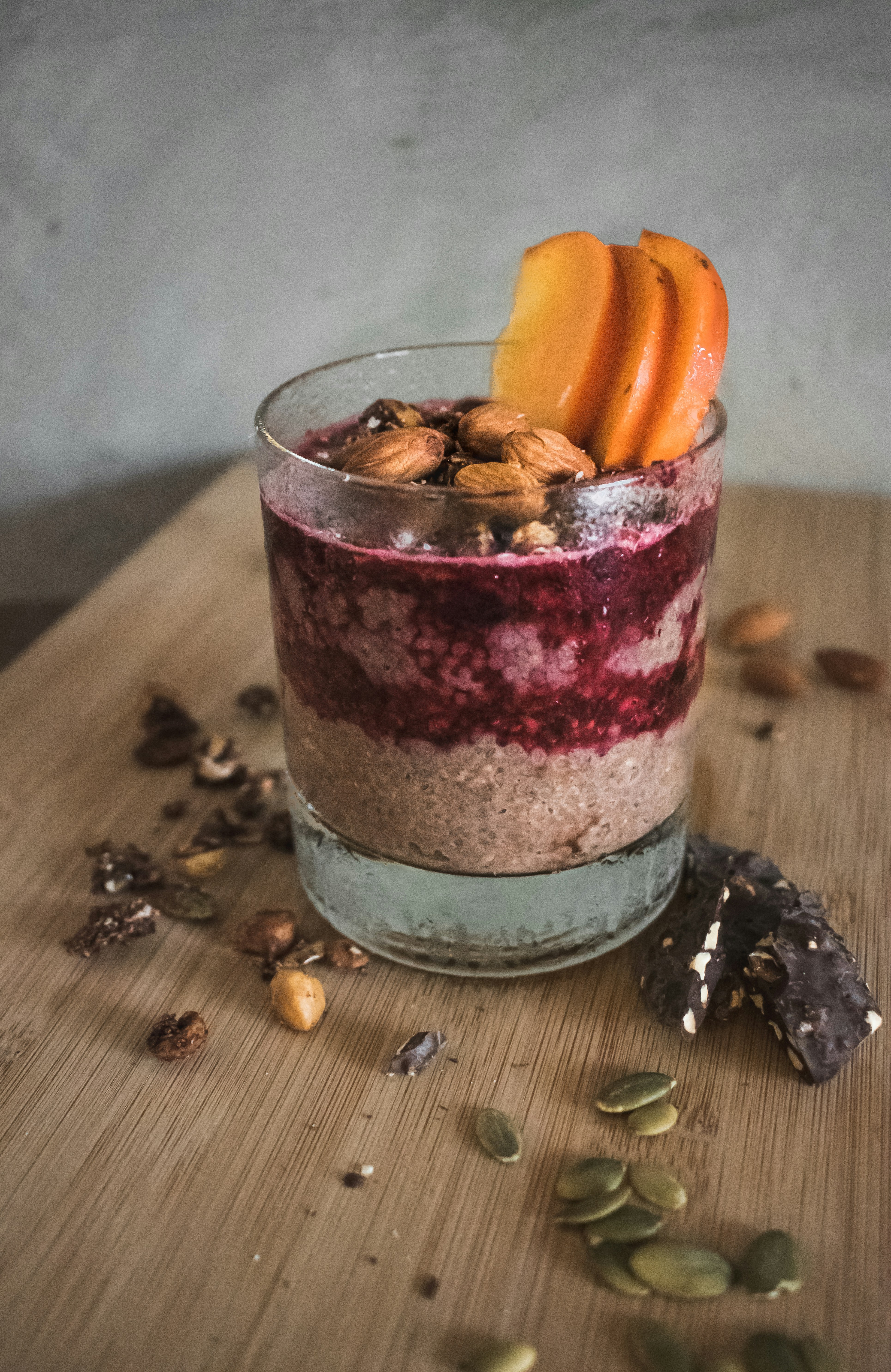 clear drinking glass with pink liquid and sliced orange fruit