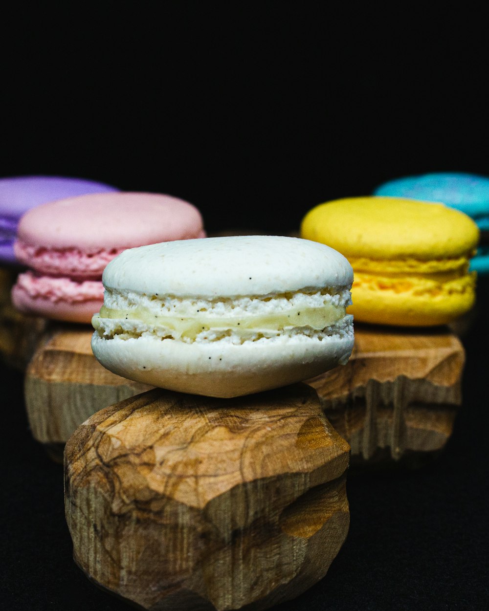 a close up of a macaron on a wooden stand