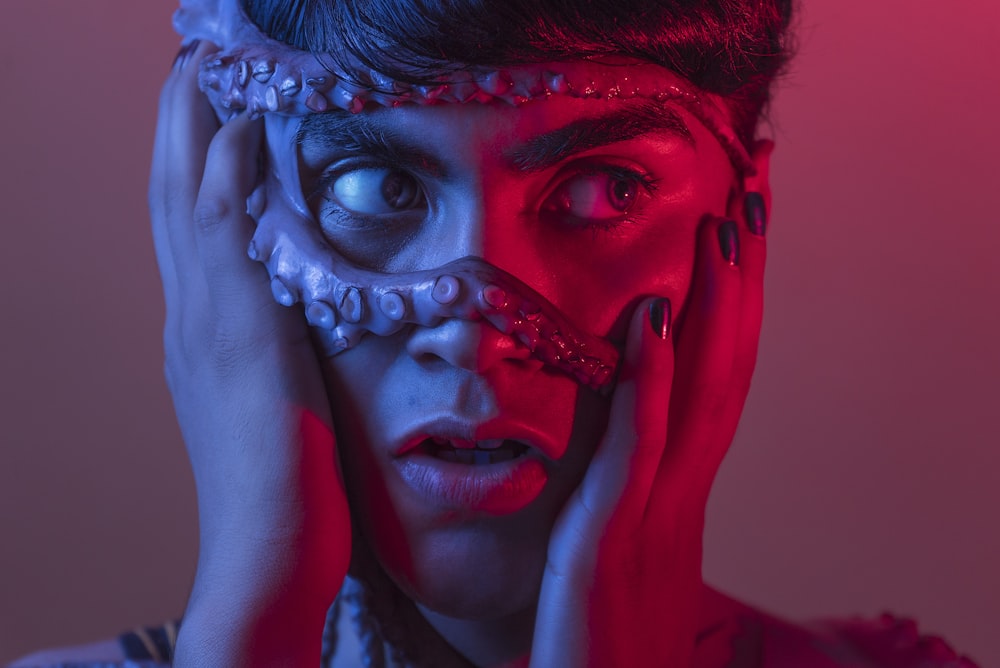 woman with red and blue face paint