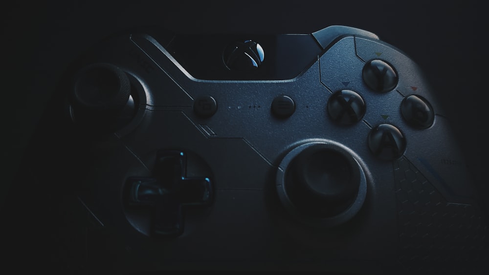 black game controller on black surface