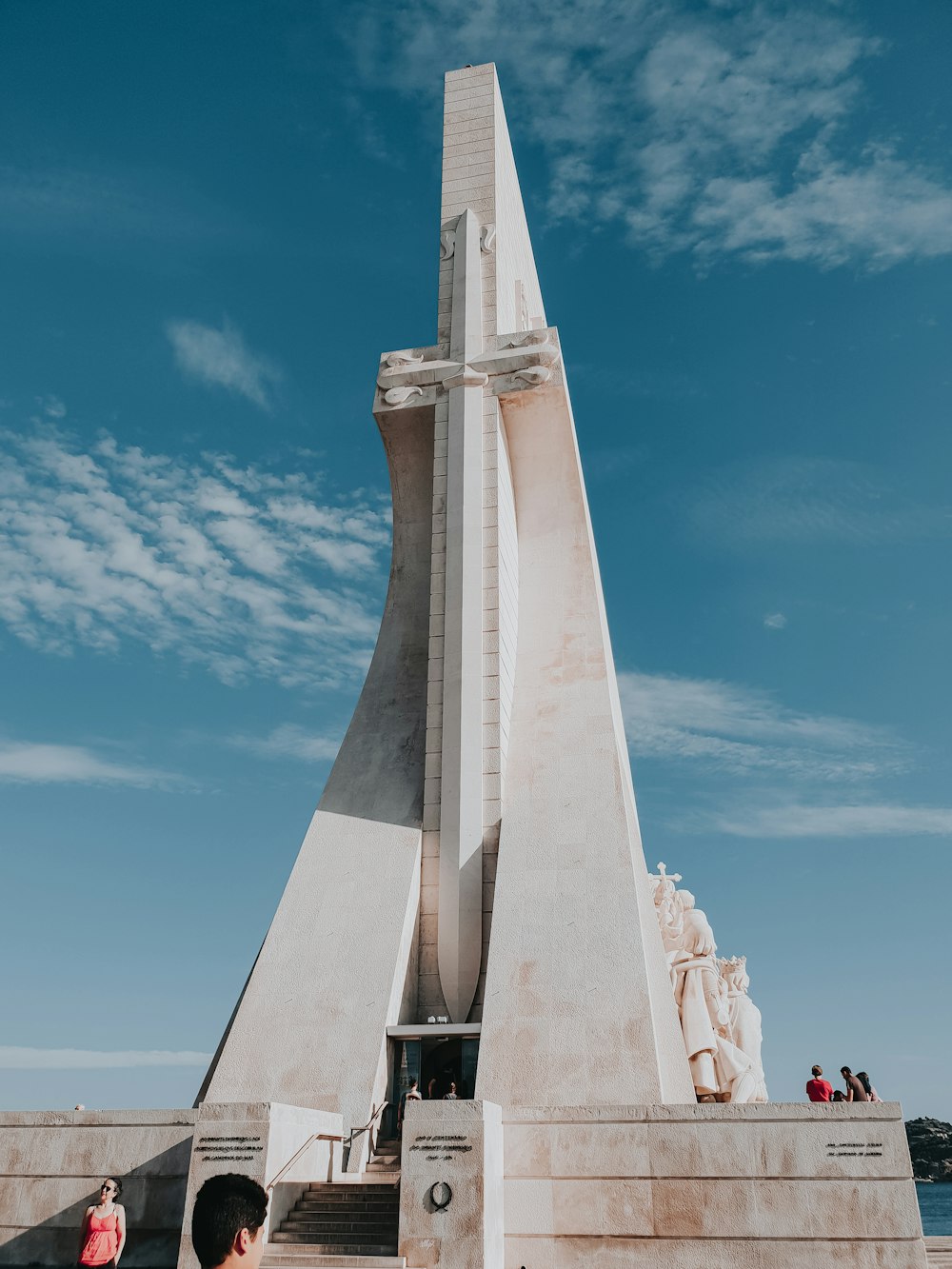 white concrete tower under blue sky during daytime