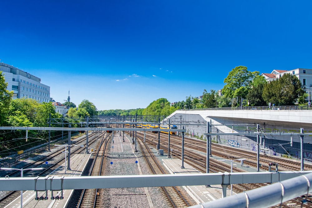 gray metal train rail during daytime