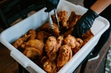 A team member inspecting quality control of chicken products.