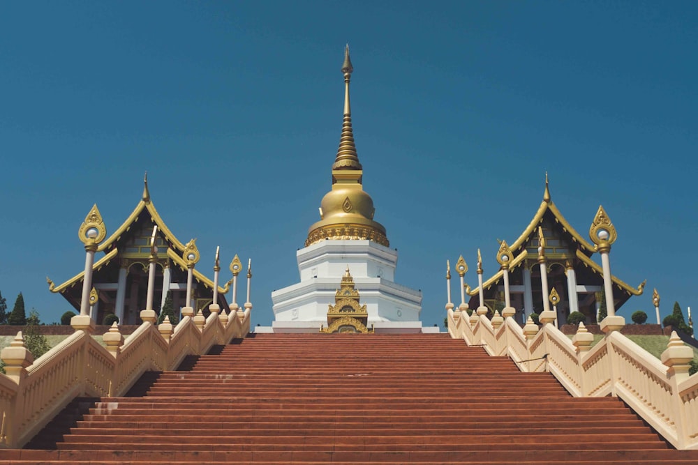 gold and white temple under blue sky during daytime