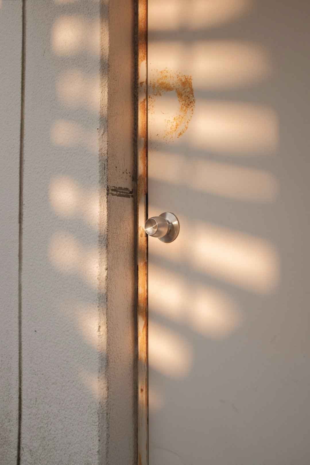 brown wooden door with silver door lever