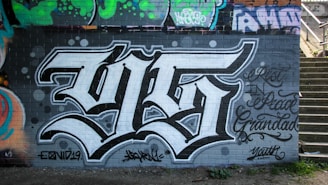 black and white graffiti on wall
