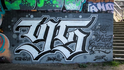 black and white graffiti on wall