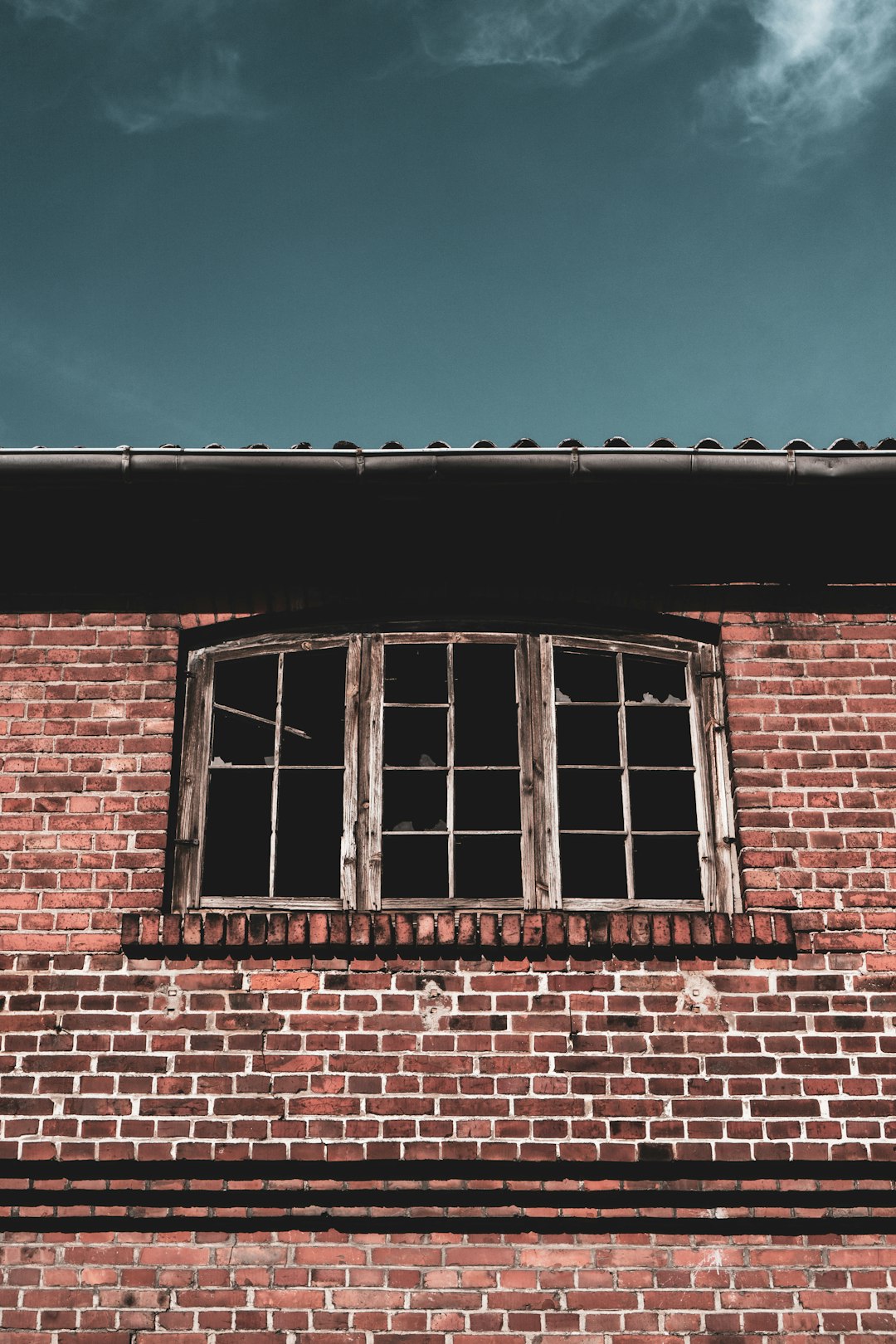 brown brick building with glass windows