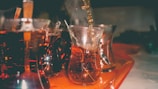 Image illustrating diverse drinks being poured automatically.