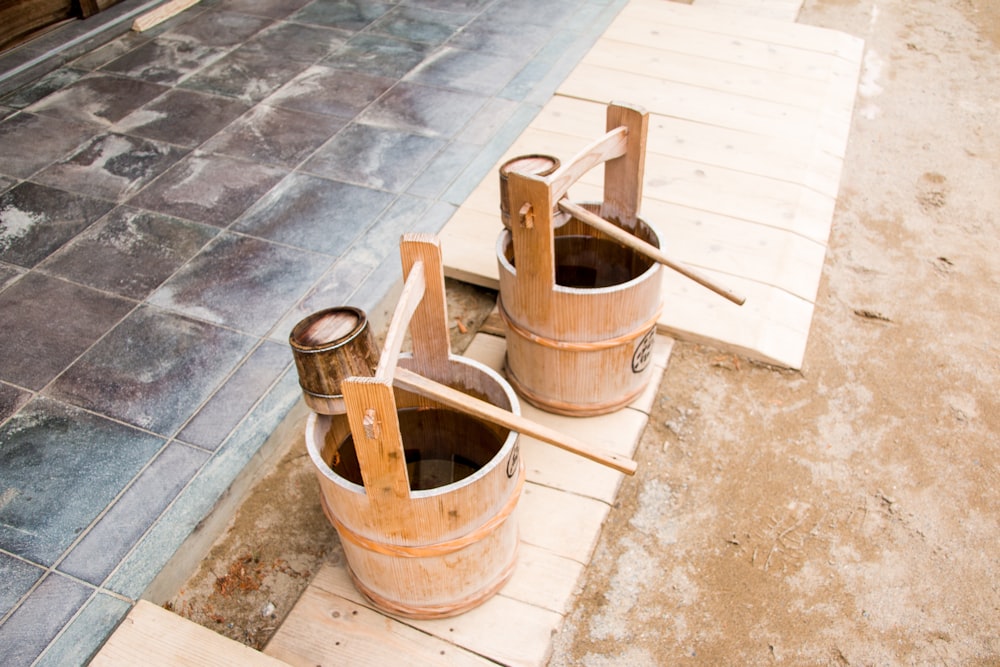 brown wooden bucket with brown wooden handle