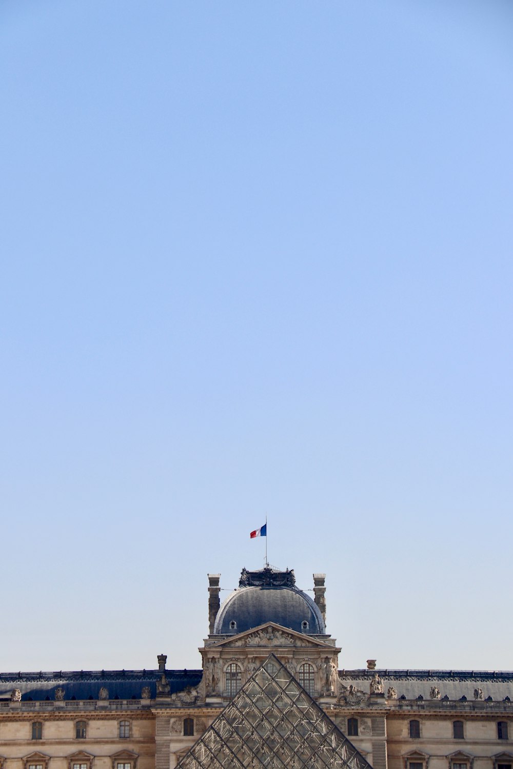 black and white concrete building under blue sky during daytime