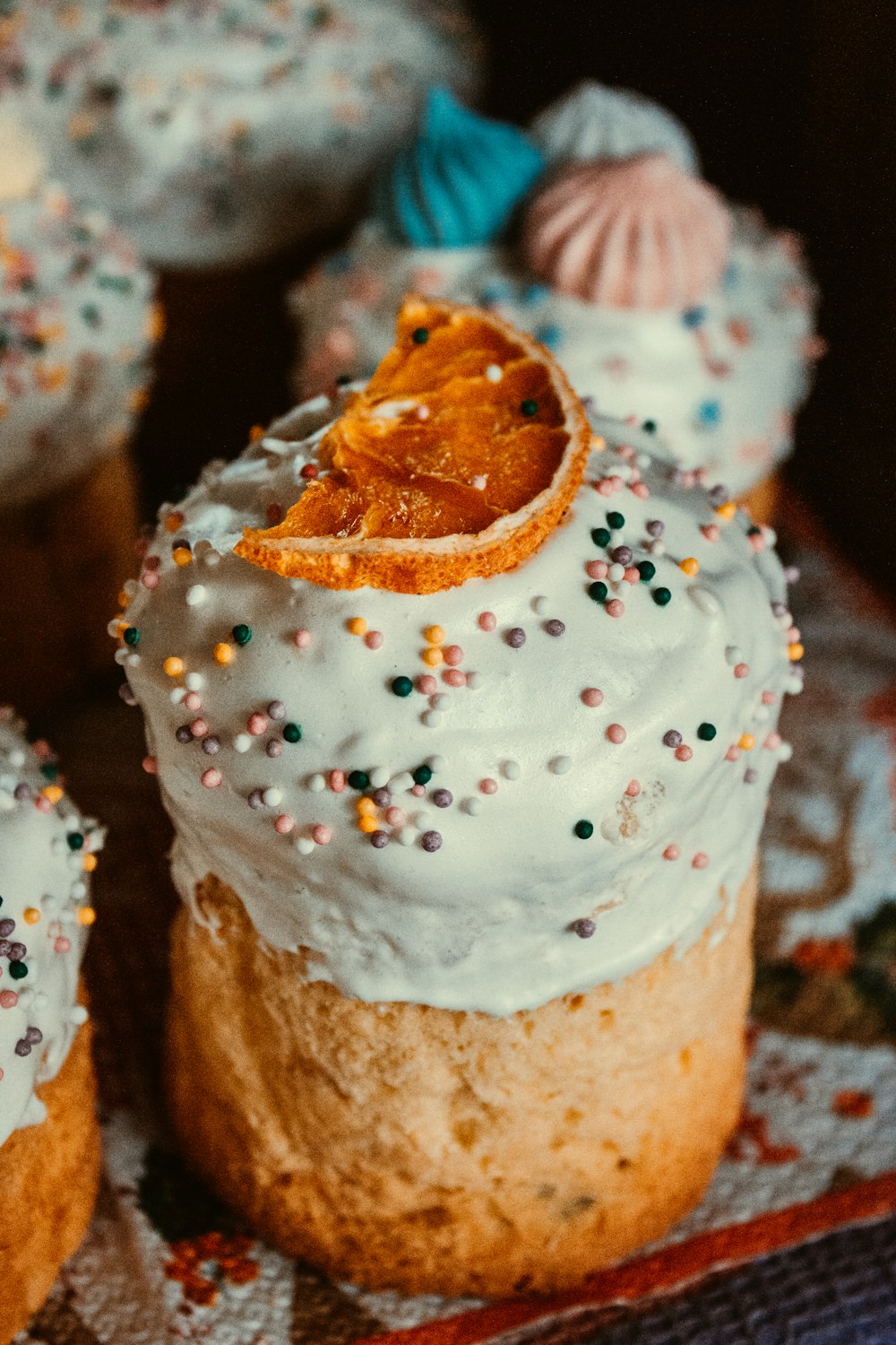 white and brown cupcake with white icing on top