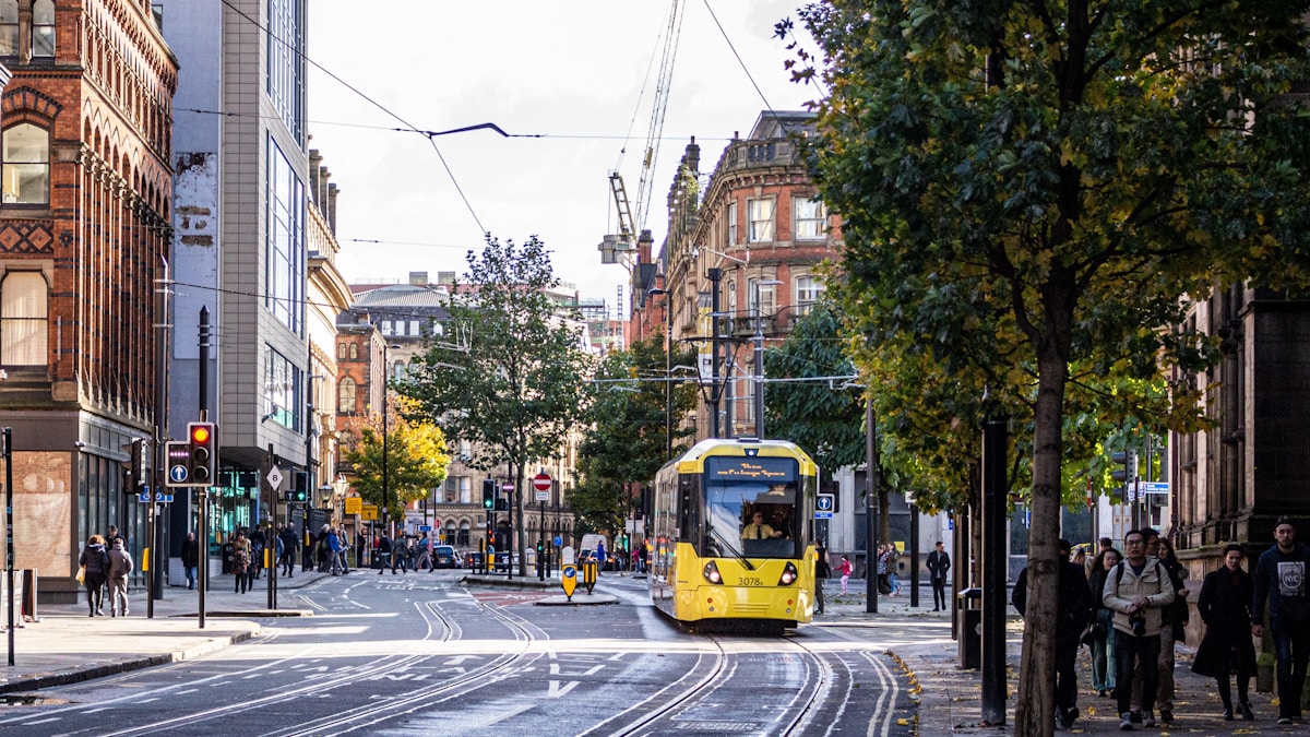 yellow and black tram on road during daytime