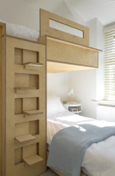 white bed linen near brown wooden bed frame