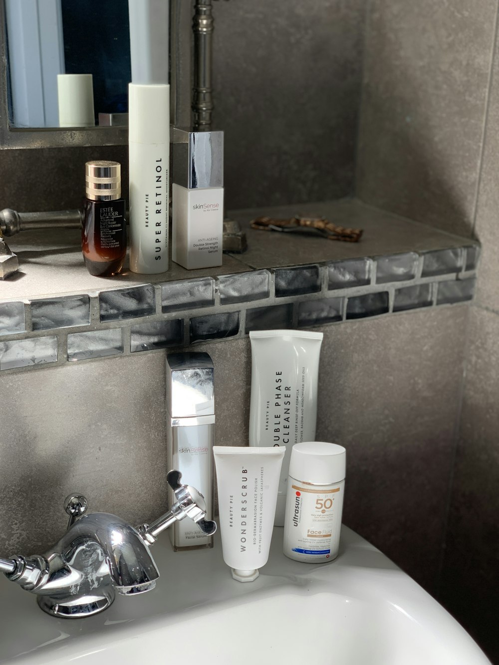 white plastic bottle on stainless steel sink