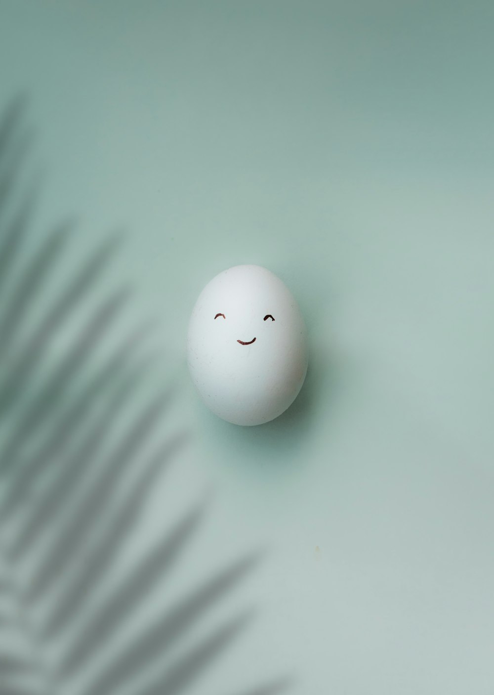 white round ball on green surface