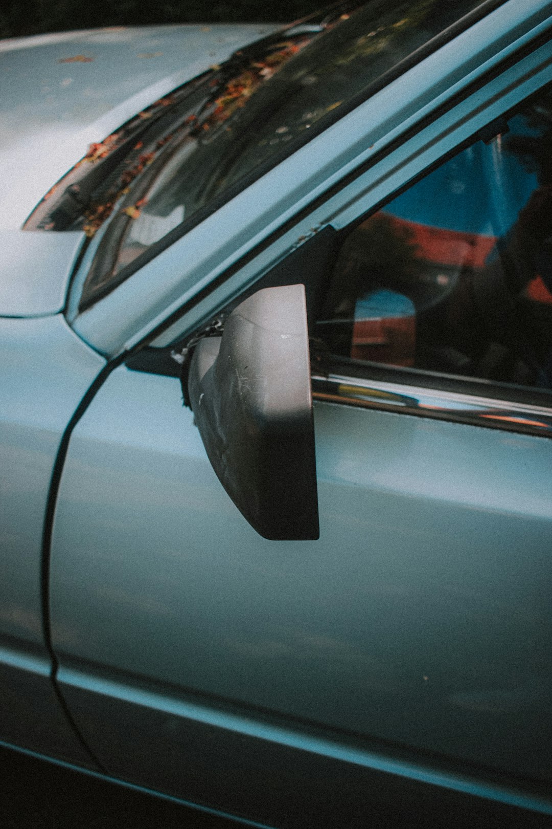 black car side mirror during daytime