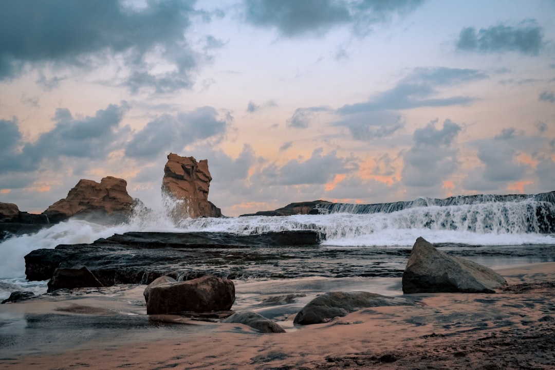 travelers stories about Shore in Pantai Klayar, Indonesia