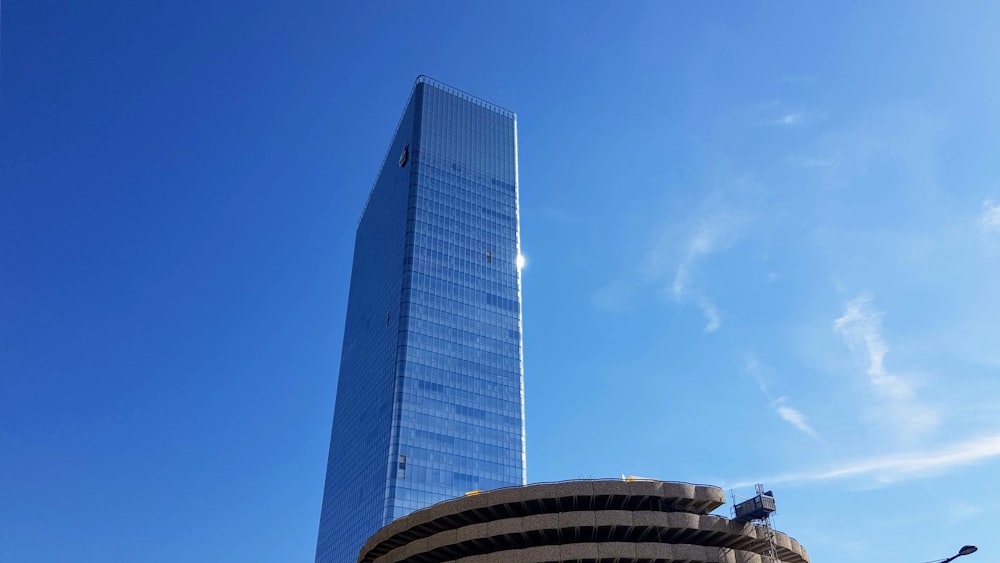 white and blue glass building under blue sky during daytime