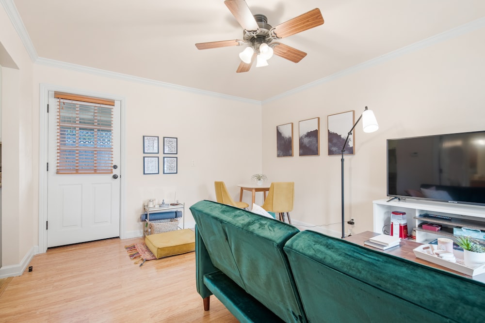 white and brown 4 bladed ceiling fan with light fixture